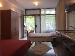 Ένα ή περισσότερα κρεβάτια σε δωμάτιο στο Studio Max