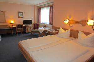 Un pat sau paturi într-o cameră la Hotel Plainbrücke | self check-in