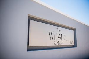 a picture frame hanging on a wall at The Whale on Main B&B in Hermanus