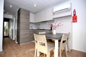 a kitchen and dining room with a table and chairs at Mobile homes-Slanica in Murter