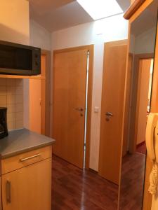 Kuchyň nebo kuchyňský kout v ubytování Apartment Sonnblick