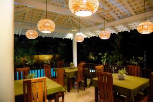 Reštaurácia alebo iné gastronomické zariadenie v ubytovaní Odailem Resort - Talpe