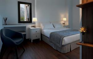 En eller flere senge i et værelse på La Frasera Alojamiento Rural