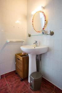 a bathroom with a sink and a mirror at Maison Lous Amics in Orx +34 photos