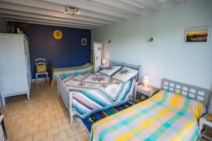 a bedroom with two beds in a room at Maison Lous Amics in Orx