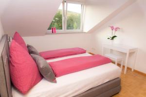 A bed or beds in a room at Ferienwohnung Schneckental