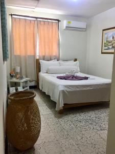 Postel nebo postele na pokoji v ubytování Hotel Casa Telma