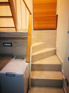 a stairwell in a tiny house with a stair case at mono locale in Turin