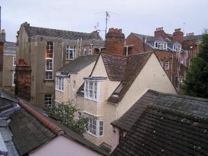 a group of houses in a city with roofs at Bath Place Hotel in Oxford