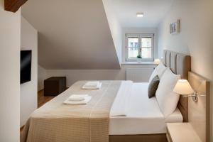 Postel nebo postele na pokoji v ubytování Louren Apartments