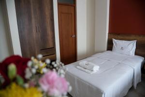 Postel nebo postele na pokoji v ubytování Hotel Central