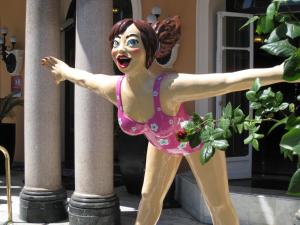 a statue of a woman in a pink dress at Hôtel Le Royal Promenade des Anglais in Nice