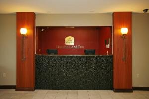 a lobby with a reception desk in a building at Baymont by Wyndham Dale in Dale