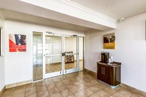 a room with a glass door and a tile floor at Motel 6-Euless, TX - DFW West in Euless
