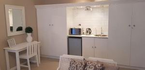 Kuchyň nebo kuchyňský kout v ubytování Mulberry Place
