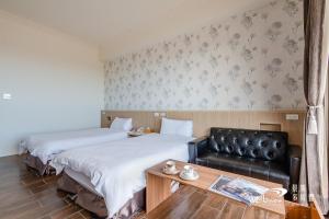 Postel nebo postele na pokoji v ubytování Taroko Inn