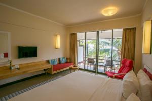 Postel nebo postele na pokoji v ubytování Rayong Resort Hotel โรงแรมระยองรีสอร์ท