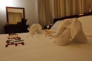 Letto o letti in una camera di Virtue Highland Hotel
