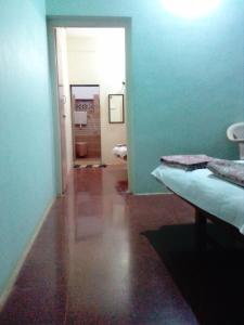 Postel nebo postele na pokoji v ubytování Hotel Anjali Lodge Malvan