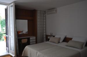 Krevet ili kreveti u jedinici u objektu Beach apartment in the center of Brela