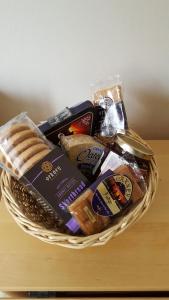 a basket of food and snacks on a table at Orkneyinga in Kirkwall