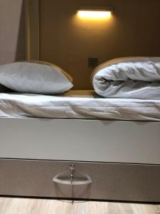 Postel nebo postele na pokoji v ubytování Travel Inn Hostel