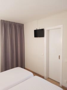 TV a/nebo společenská místnost v ubytování Hostal Ondina