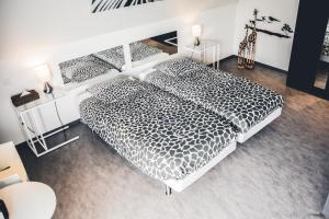 Katil atau katil-katil dalam bilik di Vakantiewoning Hakuna Matata