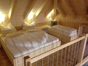 Postel nebo postele na pokoji v ubytování Hotel Garni Bergwelt