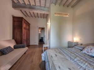 เตียงในห้องที่ Apartment La Scala 1572