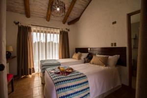 Hotel El Molino tesisinde bir odada yatak veya yataklar