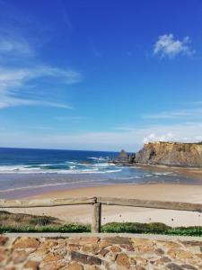 a view of a beach with the ocean at Sol Mar in Odeceixe