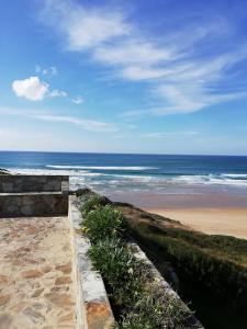 a view of a beach with the ocean at Sol Mar in Odeceixe