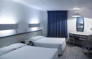 Postel nebo postele na pokoji v ubytování HOTEL OLIDEN