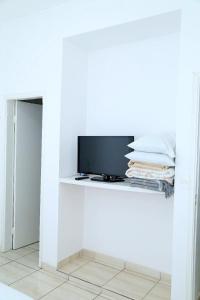 TV a/nebo společenská místnost v ubytování Hotel dos Lagos