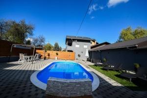 a swimming pool in the backyard of a house at "Oasis of Peace Zagreb-Apartments" in Zagreb