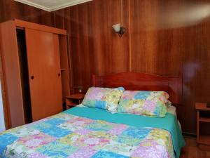 Postel nebo postele na pokoji v ubytování Hostal Dinamarca