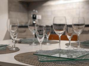 a group of wine glasses sitting on a table at MAMA with mobile aircon, including free parking space at 300 meters in Colmar