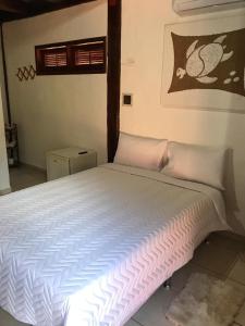 Cama ou camas em um quarto em Pousada Vila do Sol Juquehy