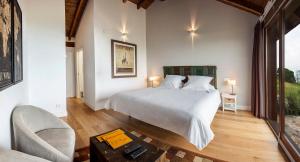 Katil atau katil-katil dalam bilik di Hotel Rural 3 Cabos