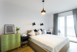 Posteľ alebo postele v izbe v ubytovaní Nowy Apartament Atal Tower - Garaż - Taras Widokowy - Centrum