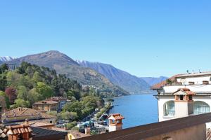 a view of a river with mountains in the background at Residence la Limonera in Bellagio