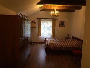 Tempat tidur dalam kamar di Villa Aromatique