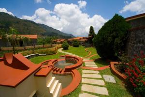 a garden with a design on the grass at Green Pastures - A Hill Country Resort in Kodaikānāl