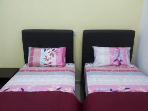 A bed or beds in a room at Sunshine Jonker Guesthouse
