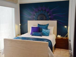 Gulta vai gultas numurā naktsmītnē Hotel & Spa Doña Urraca San Miguel De Allende