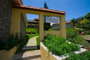 a building with a sign for a garden at Green Pastures - A Hill Country Resort in Kodaikānāl
