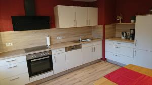 Kuchyň nebo kuchyňský kout v ubytování Gästehaus Sylvia