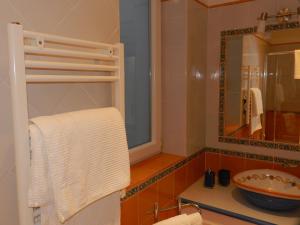 a bathroom with a sink and a mirror at villa verde sul mare in Vietri sul Mare