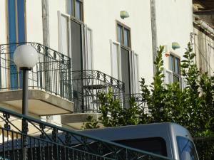 a truck parked in front of a building with balconies at villa verde sul mare in Vietri sul Mare